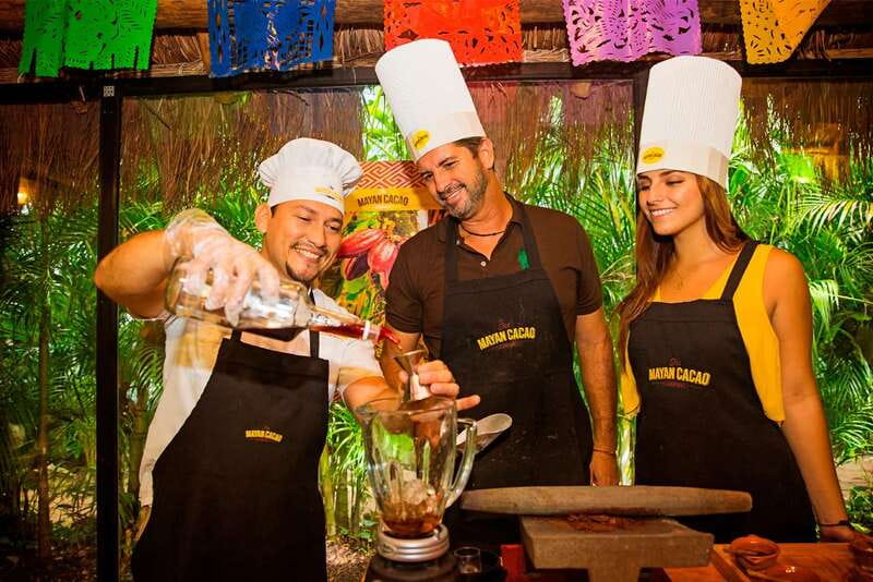 Cozumel: Chocolate Margarita Workshop with Mayan Recipe - Grinding cacao beans by hand