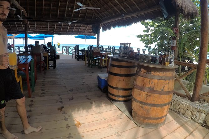Snorkeling and Beach Club Access in Cozumel with Lunch - A rocky shore with a relaxed local feel